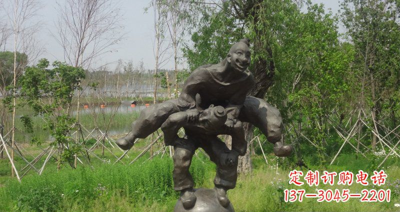 宁波园林站在球上面跳山羊的人物景观铜雕